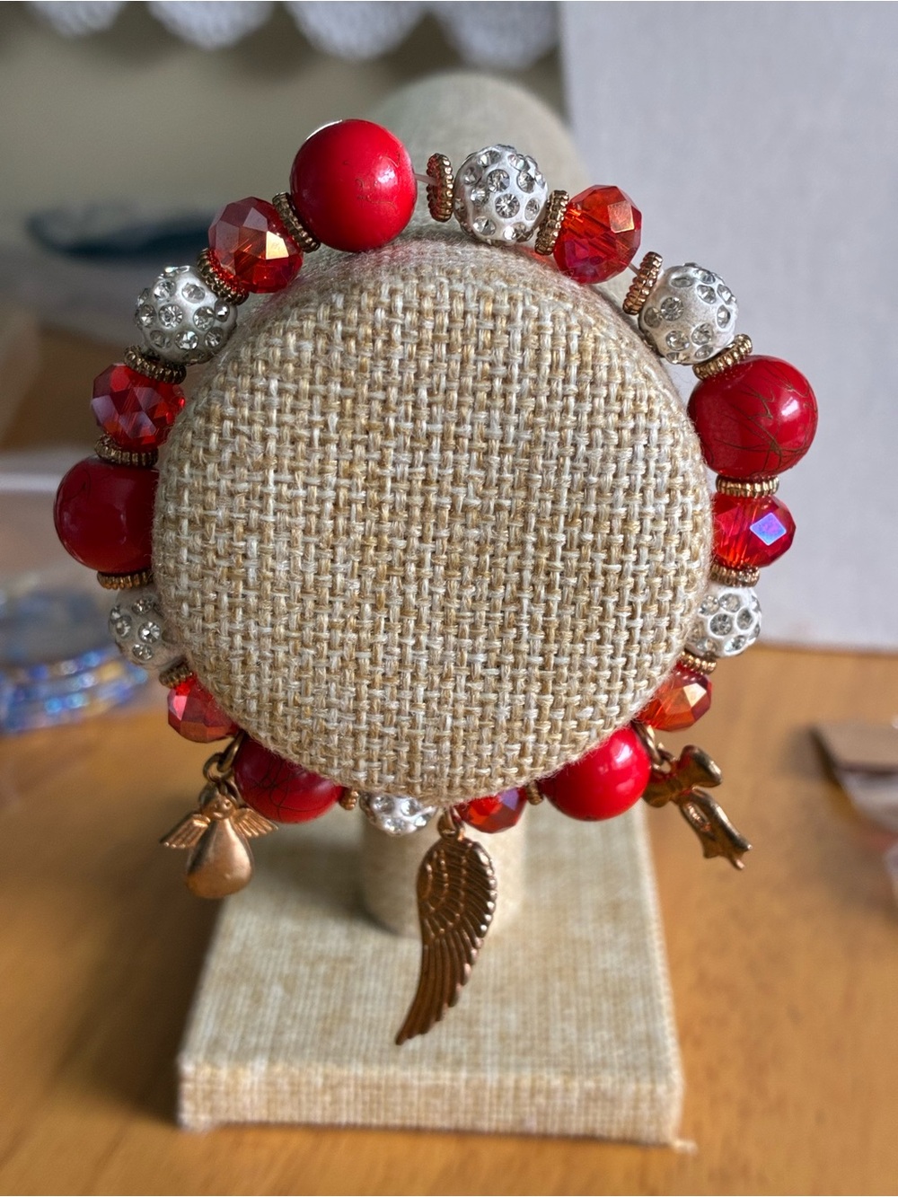Gold Wing Charm Red Beaded Stretch Bracelet
